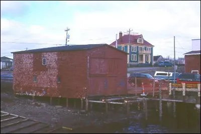 Exterior view of side and front facade, Stoodley Fishing Stage, Grand Bank, NL, under restoration.; 2003 Heritage Foundation of Newfoundland and Labrador